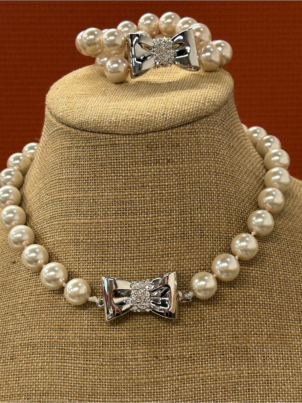 Faux pearl and silver tone rhinestone bow set